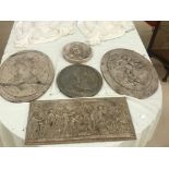 Five wall plaques in classical designs one signed Bertaux