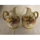 A pair of Royal Worcester jugs