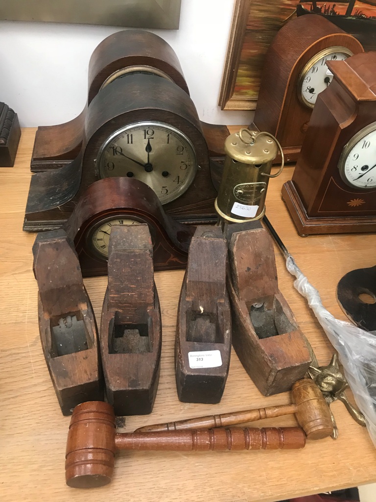 A mixed lot of items comprising two mantel clocks and a smaller example; together with four planes,