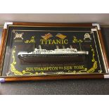 A framed and glazed wall plaque of Titanic