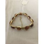 A 14k gold and amber bracelet