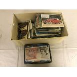 A quantity of postcards and banknotes