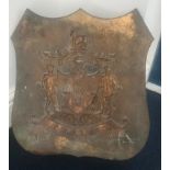 A heavy bronze armorial shield depicting two ships with three pelleted crosses with turbaned