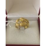 A floral design gold ring