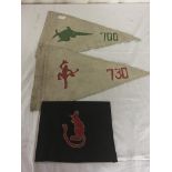 A pair of German U-boat flags and a Desert Rat pendant