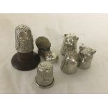 Four HM silver animal thimbles;