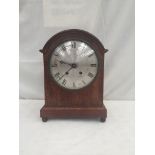 A mahogany mantel clock