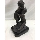 A bronze figure of two putti on base