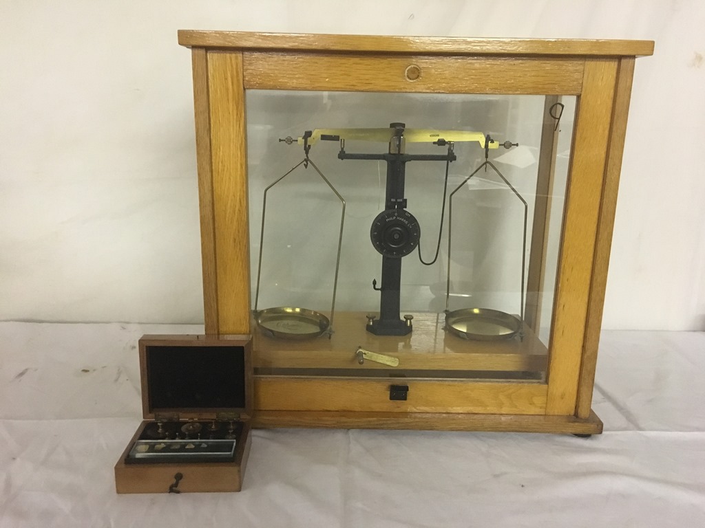 A set of cased pharmaceutical scales and weights