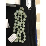 A graduated jade bead necklace of good translucent celadon colour, no clasp,