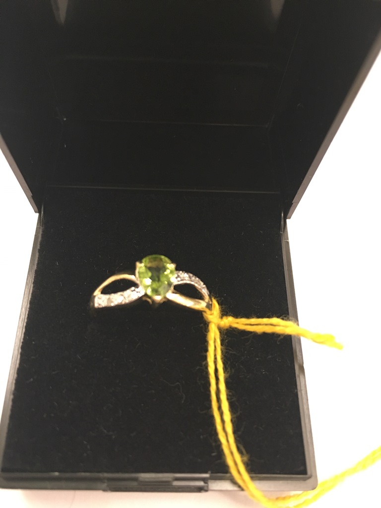 A 9ct gold pear-cut peridot and diamond ring