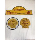 Three cast-iron Shell advertising signs