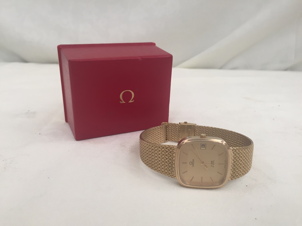 An original shop boxed Omega Deville watch with paperwork