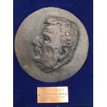 L S Lowry interest: A cased bronze relief medallion depicting a profile portrait of L S Lowry by