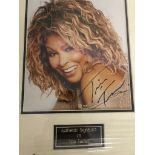 A framed and glazed signed photograph of Tina Turner (with COA)