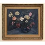 An oil on board depicting a floral still life, signed lower left,