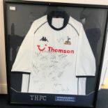 A multi-signed framed Spurs shirt,