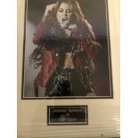 A framed and glazed signed photograph of Miley Cyrus (with COA)