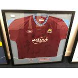 A multi-signed framed West Ham shirt,