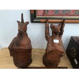 A pair of figures depicting a dragon and unicorn,