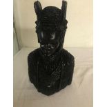 A carved ebony figure of an obi