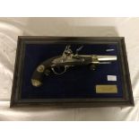 A mounted and framed reproduction Napoleonic pistol