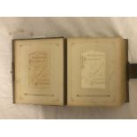 A Victorian photograph album in a quality leather-bound book with catch