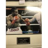 A framed and glazed signed photograph of Lennox Lewis (with COA)