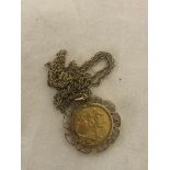 A 1915 London Mint sovereign in mount and with chain