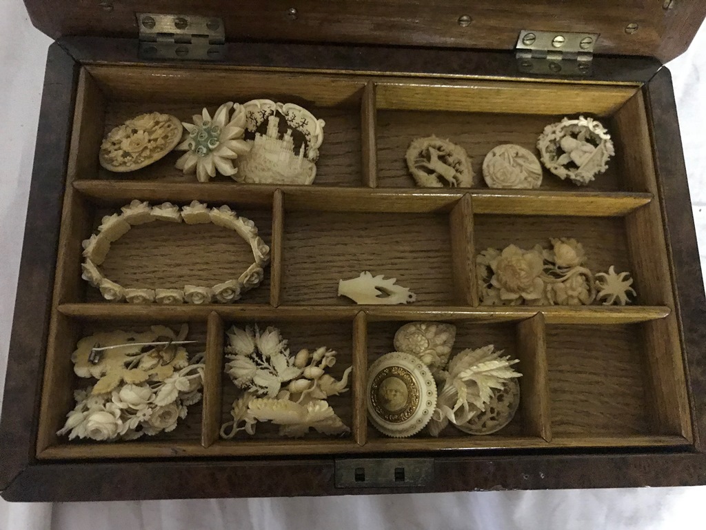 A birdseye maple box with ivory jewellery from the 1920s and 30s