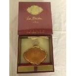 A Lalique Le Baiser perfume bottle and box