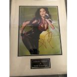 A framed and glazed signed photograph of Nicole Sherzinger (with COA)