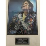 A framed and glazed signed photograph of Michael Jackson (with COA)