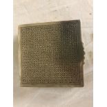 A Persian hallmarked white metal geometric patterned table cigarette box