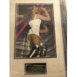 A framed and glazed signed photograph of Kylie Minogue (with COA)