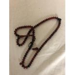 A cherry amber rosary/necklace