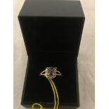 A 9ct gold amethyst and diamond ring