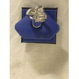 An 18ct gold diamond ring set with baguette and brilliant cut diamonds,