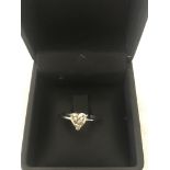 An 18ct white gold heart cut diamond solitaire,