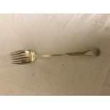 An early 19th century silver spoon with armorial converted to a salad server