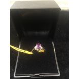 A 9ct amethyst and diamond ring