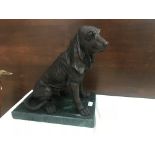 A bronze bloodhound on a marble base