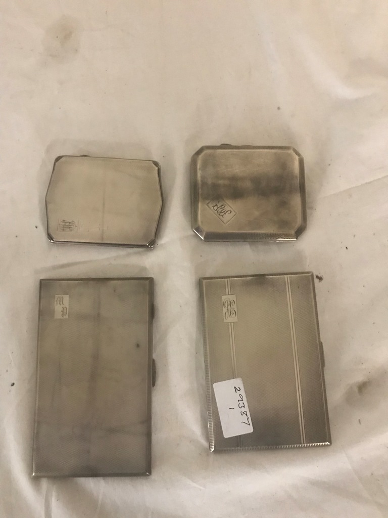 Four HM silver cigarette cases