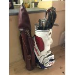 Two sets of golf clubs