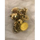 A 9ct gold charm bracelet & charms to inc.