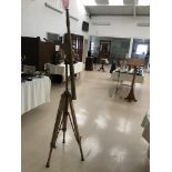 A bronze telescope on a wooden stand