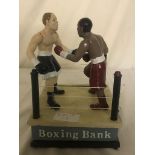 A money box in the form of two boxers