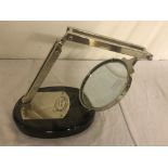 A large magnifying glass on stand