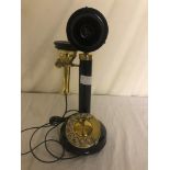 A candlestick telephone