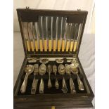 A cased 'Old English' pattern oak canteen of cutlery